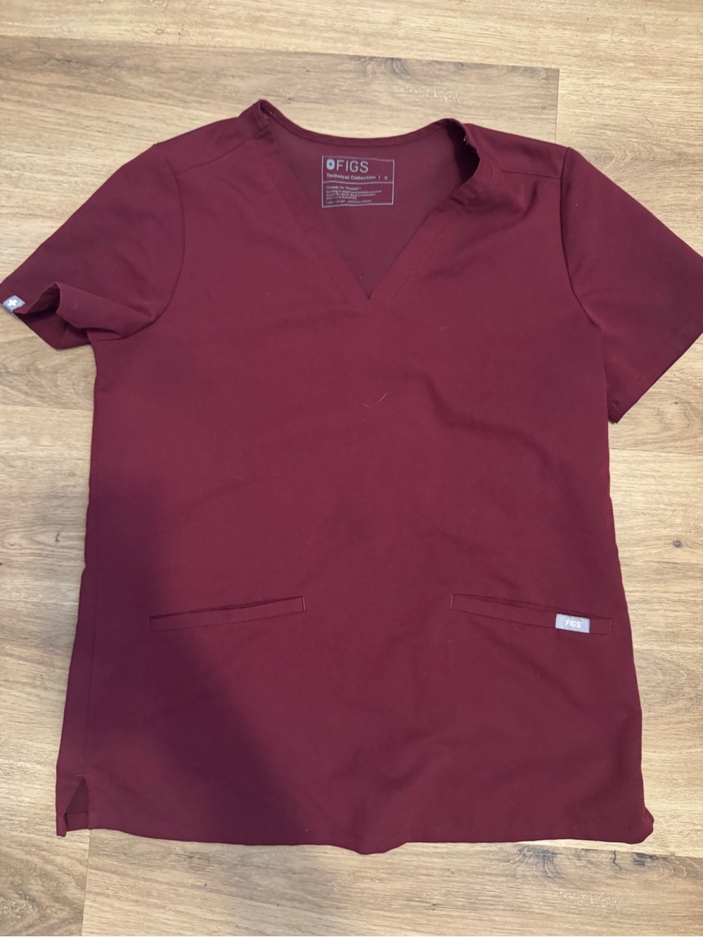 FIGS Women's Short Sleeve V-Neck Scrub Top in Burgundy